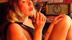 Sexy girl smoking a cigarette has fun with latex toys