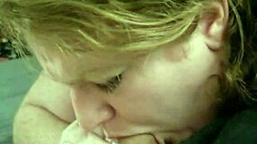 A curvaceous red headed babe gets a big dick in her mouth