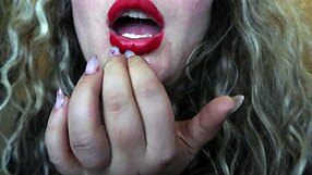 Cute red lips girl smokes and flaunts her huge b**bs