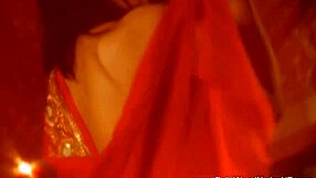 An attractive woman wears unraveling a sari for a striptease dance ritual in India