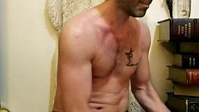 Cute man performs yoga and sins at home