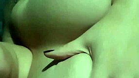 A wife with huge buttocks stimulating herself with her big breast and then inserts a private part massager on her wet pussy