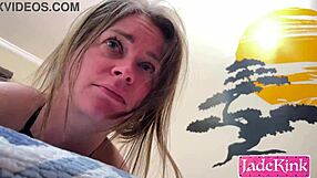 Jade is humiliated and her mouth and breasts are taped while lying on the bed during raunchy sex