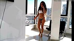 Amateur Latina slowly removes her clothes showing her attractive behind