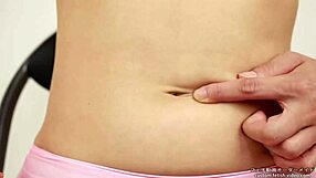 Liking to play with belly button ring Asain style