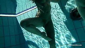Underwater pool fun with two young women in bikinis and two blond beauties