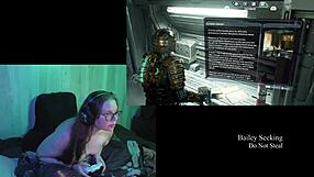 Beautiful woman with long hair playing video game naked in the background.