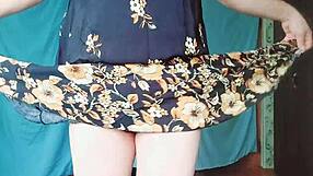 Crossdresserkitty, a blonde gay in a MILF dress, enjoys rough sex.