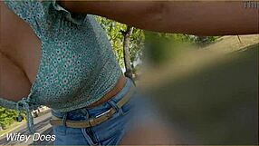 Married woman shows her breasts while riding a bike in a public road