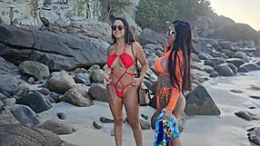 Hot girls at the beach enjoy outdoor sex and rain