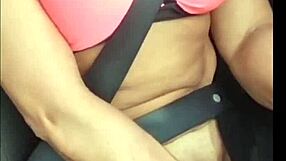 A blonde woman receives a facial while giving a blowjob in a car