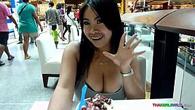 Beautiful Thai woman with natural big breasts dancing in a bar in Bangkok