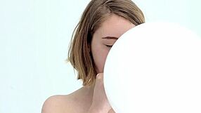Young and straight forward looner girl giving blow job to a balloon