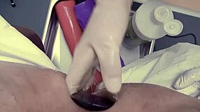 Femdom BDSM scene with a huge toy in an anal exam setting