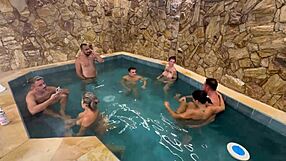 A kinky party with friends in a motel pool with an orgy