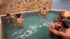 A kinky party with friends in a motel pool with an orgy