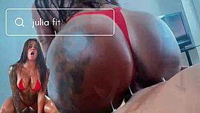 Beautiful brunette bodybuilder in red bikini, oily and sexy, gets fisted by a big cock